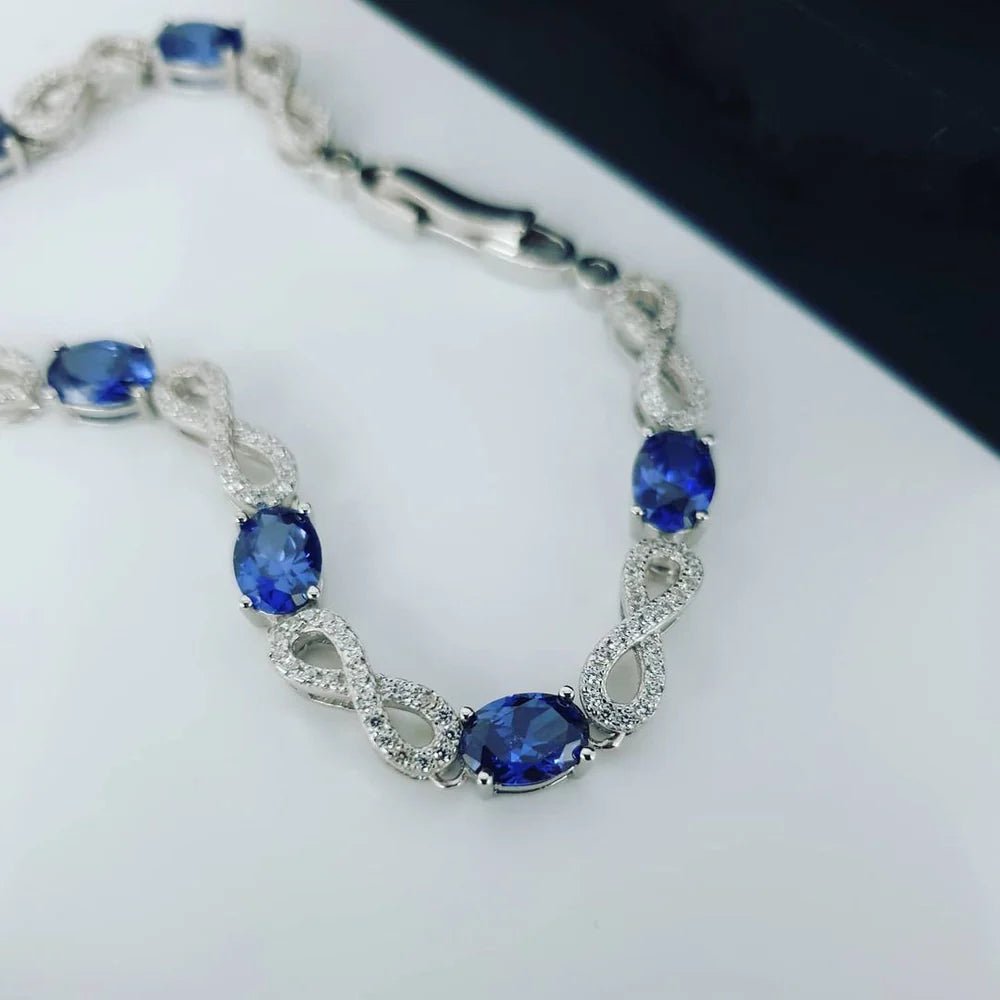 Sterling Silver Blue Sapphire CZ Infinity Bracelet - Samuel Perry